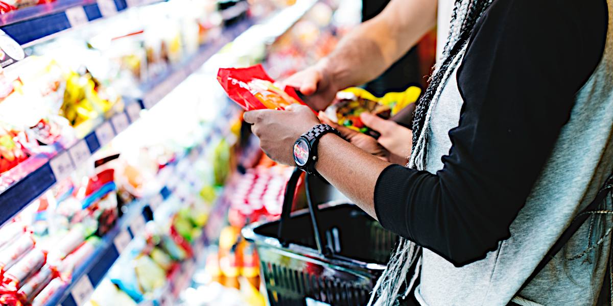 Close-up of a couple shopping at the supermarket